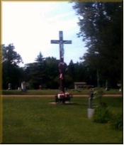 Lighted Cross in the
                              Three Lakes Cemetery