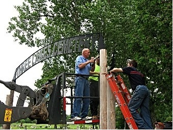Installing the Three
                              Lakes Cemetery Sign